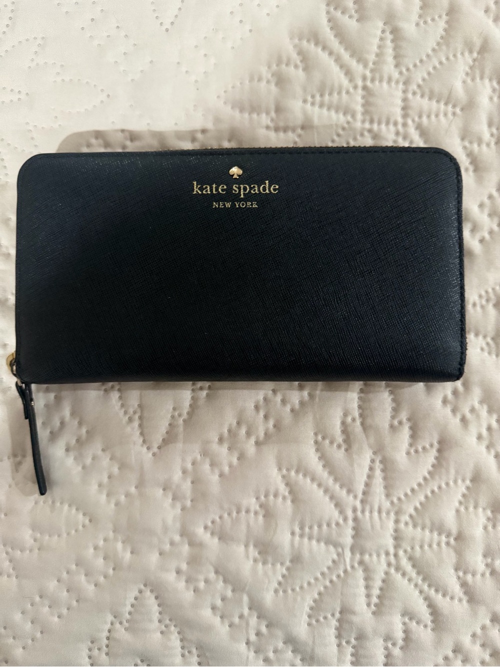 kate spade black zip-around saffiano wallet with gold logo